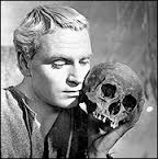 A picture of a shakespearean actor holding a human skull
